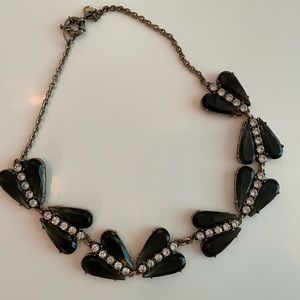 Black, crystal, and brass colored statement necklace